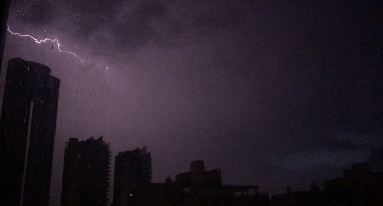 Lightning hitting el tempo building in Benidorm gota fría storm