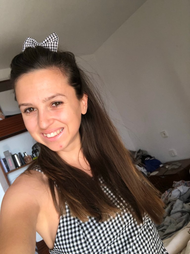 Wearing checkered dress and checkered bow