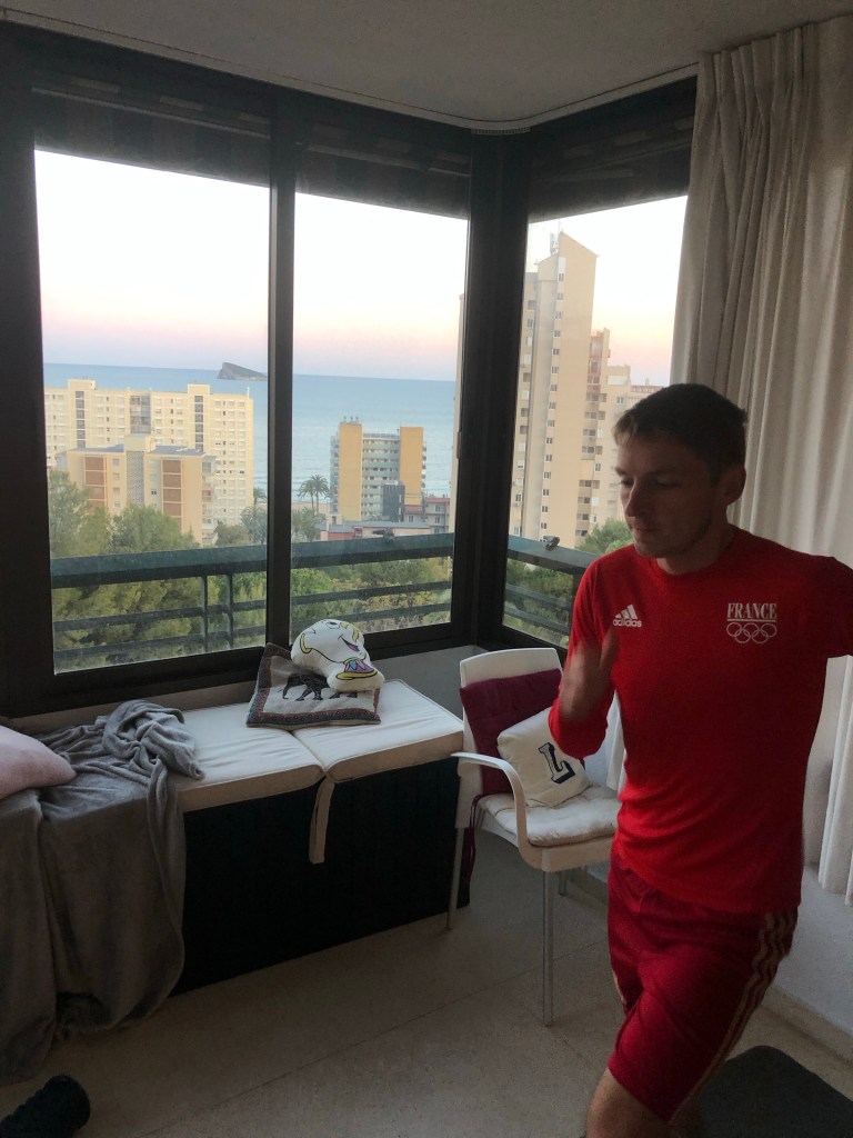 Alex working out sunset behind 