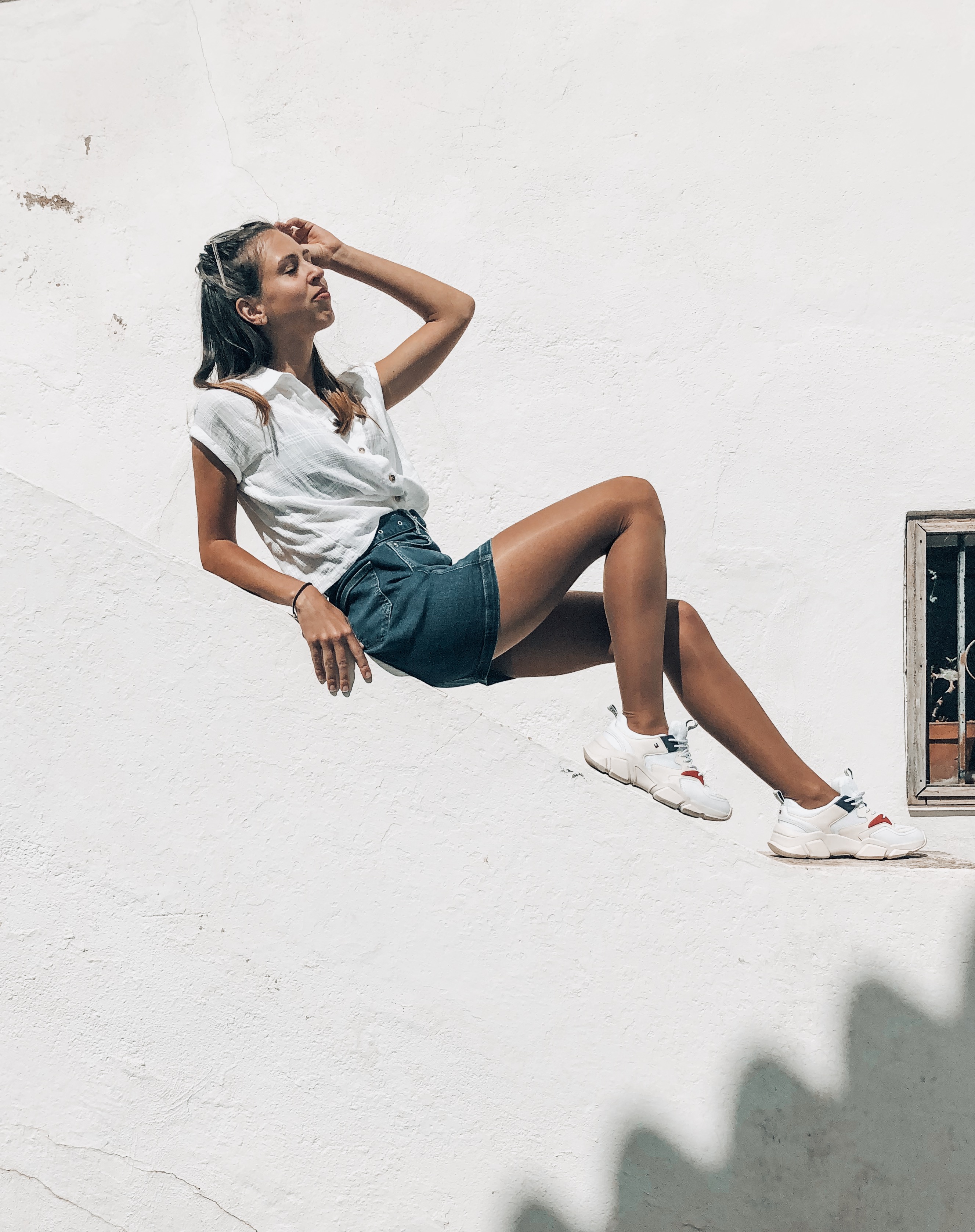 laying on wall tommy hilfiger denim skirt, white shirt altea spain 2019
