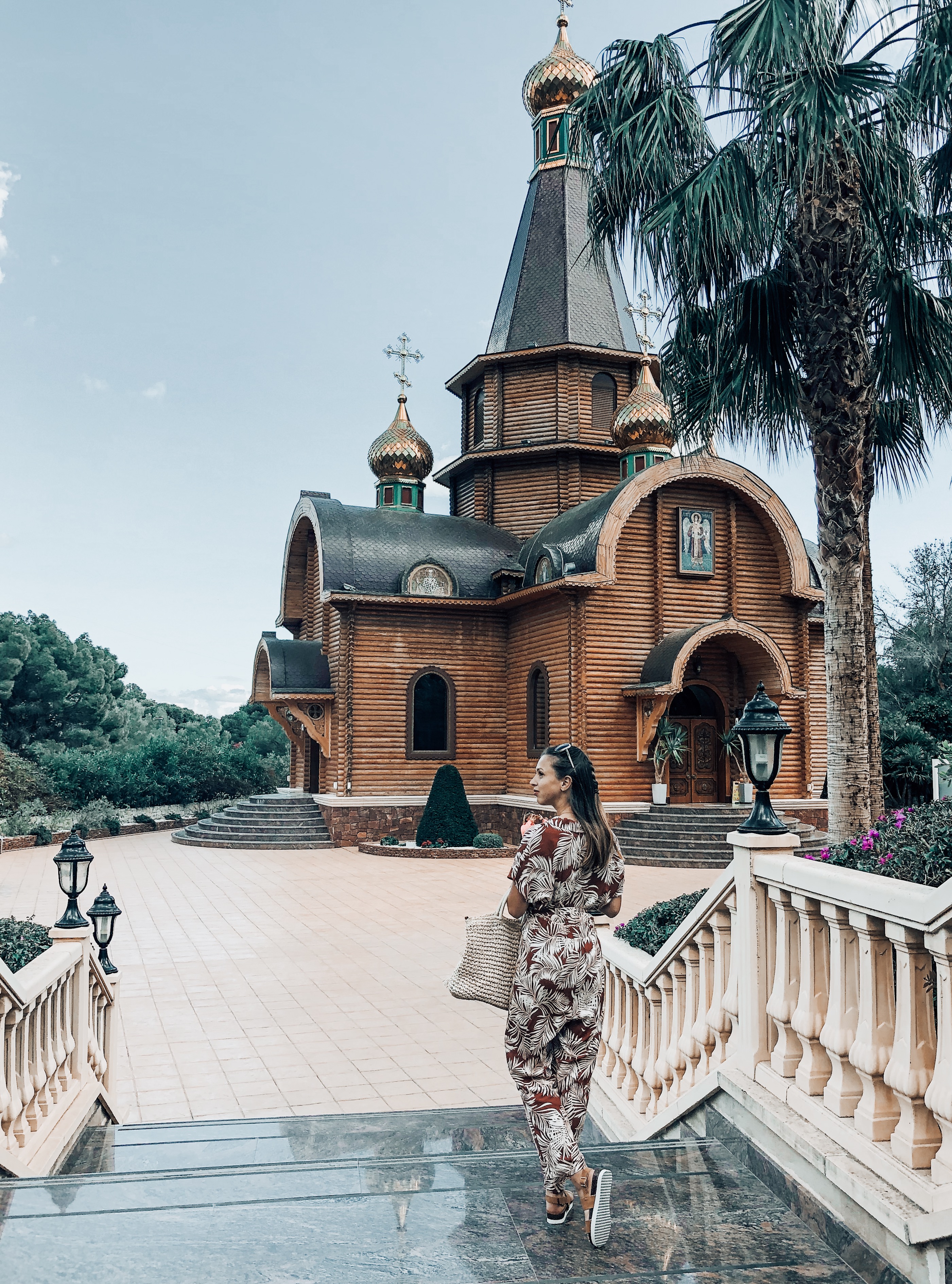 outside russian orthodox church with jumpsuit spring styles