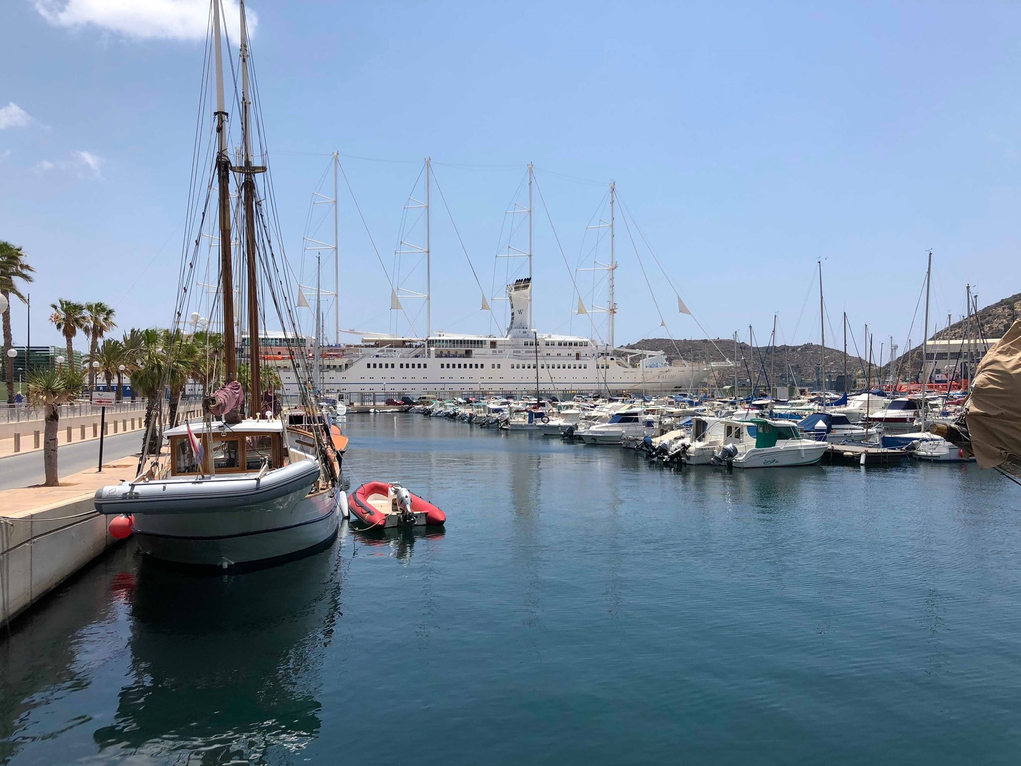 cartagena spain port with a yaht at the back and boat to the left