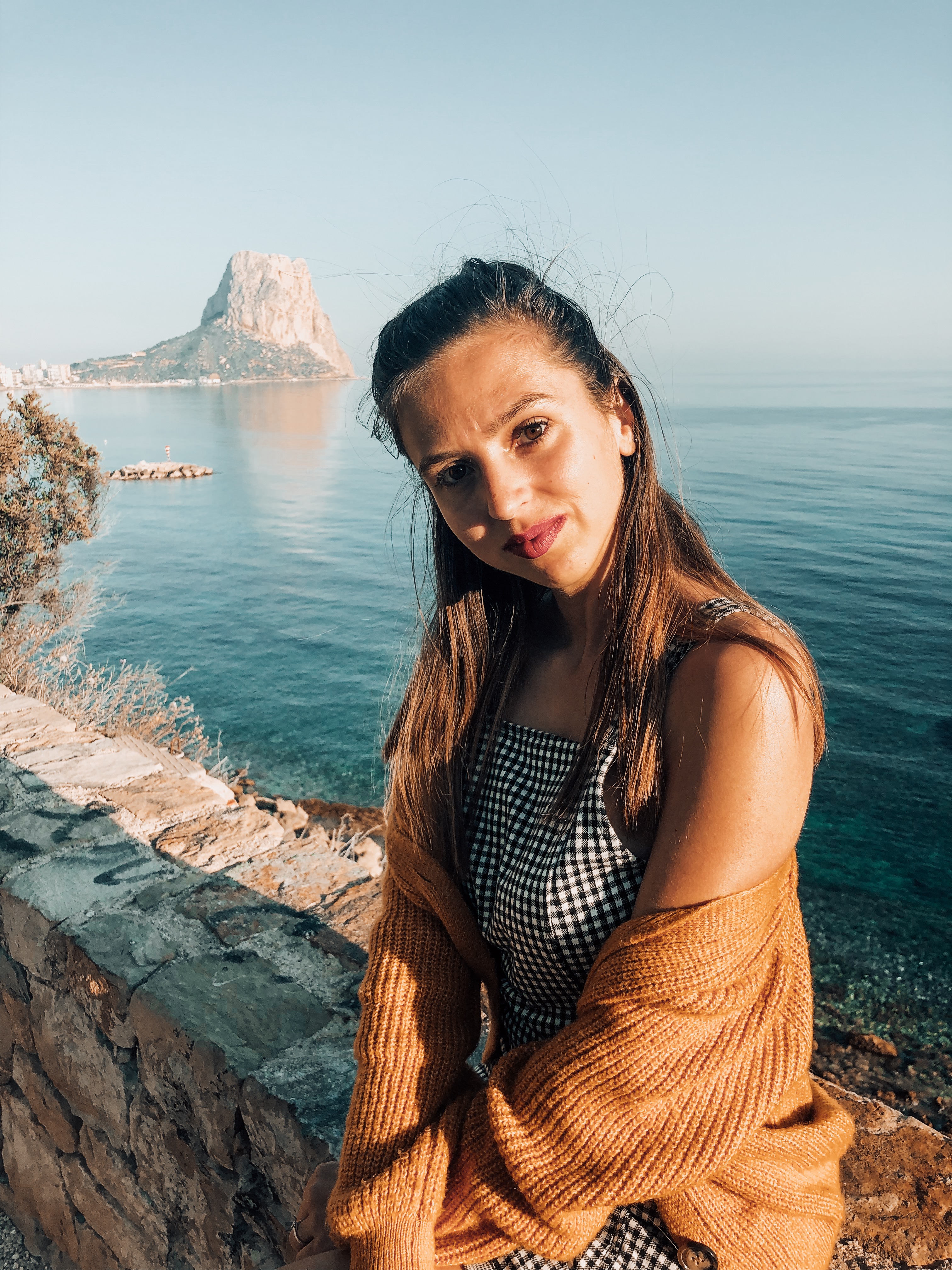 sitting on edge with calpe rock