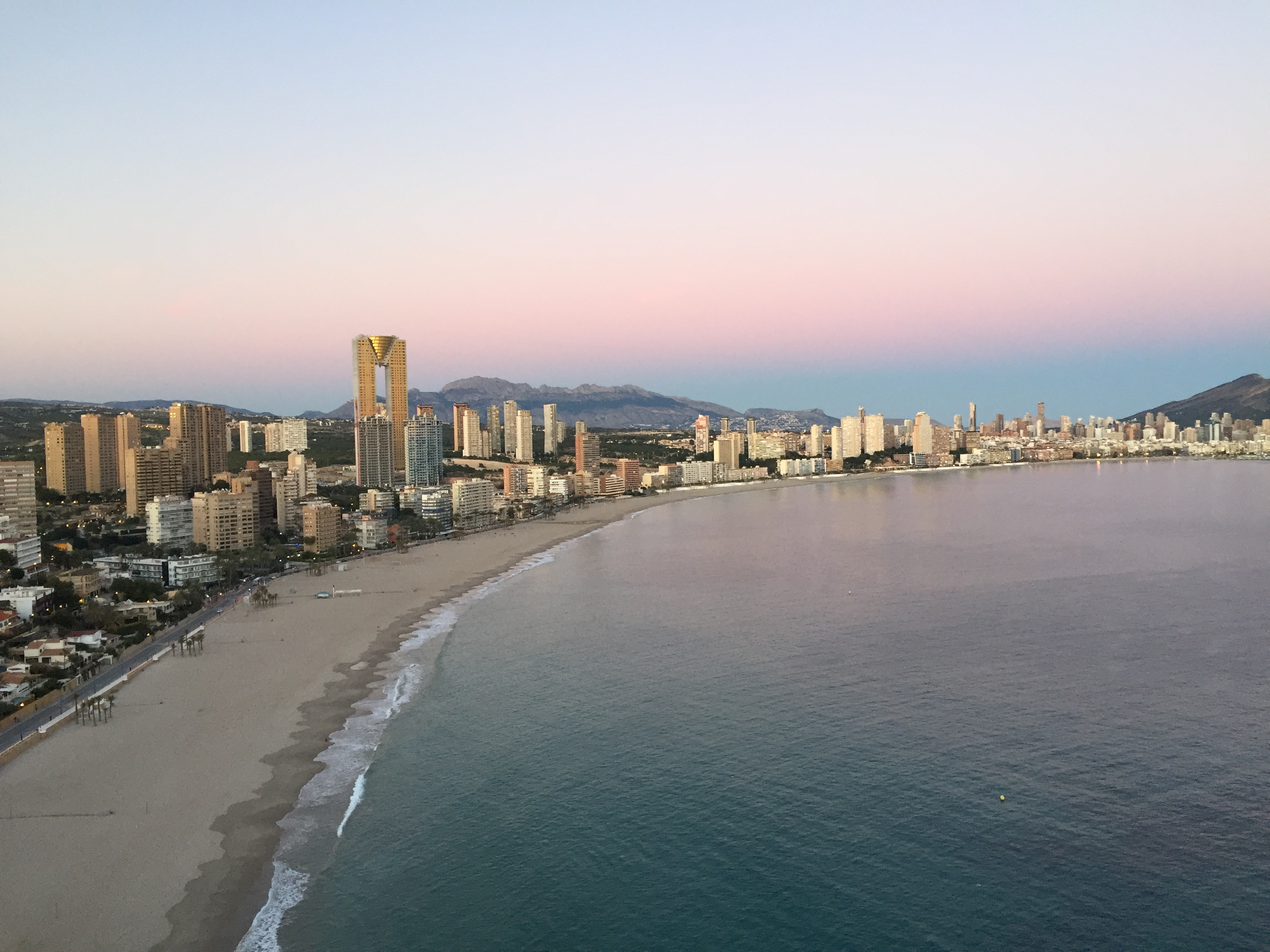beautiful pink sky from the tossal at benidorm at sunset