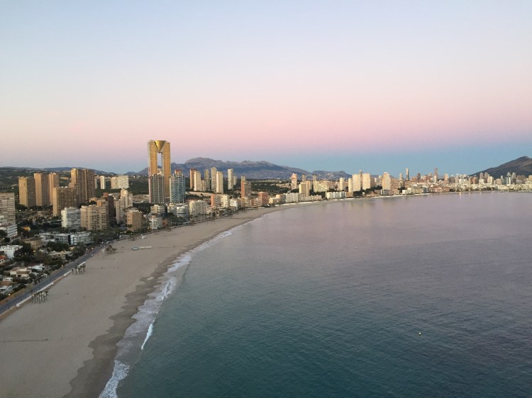 beautiful pink sky from the tossal at benidorm at sunset