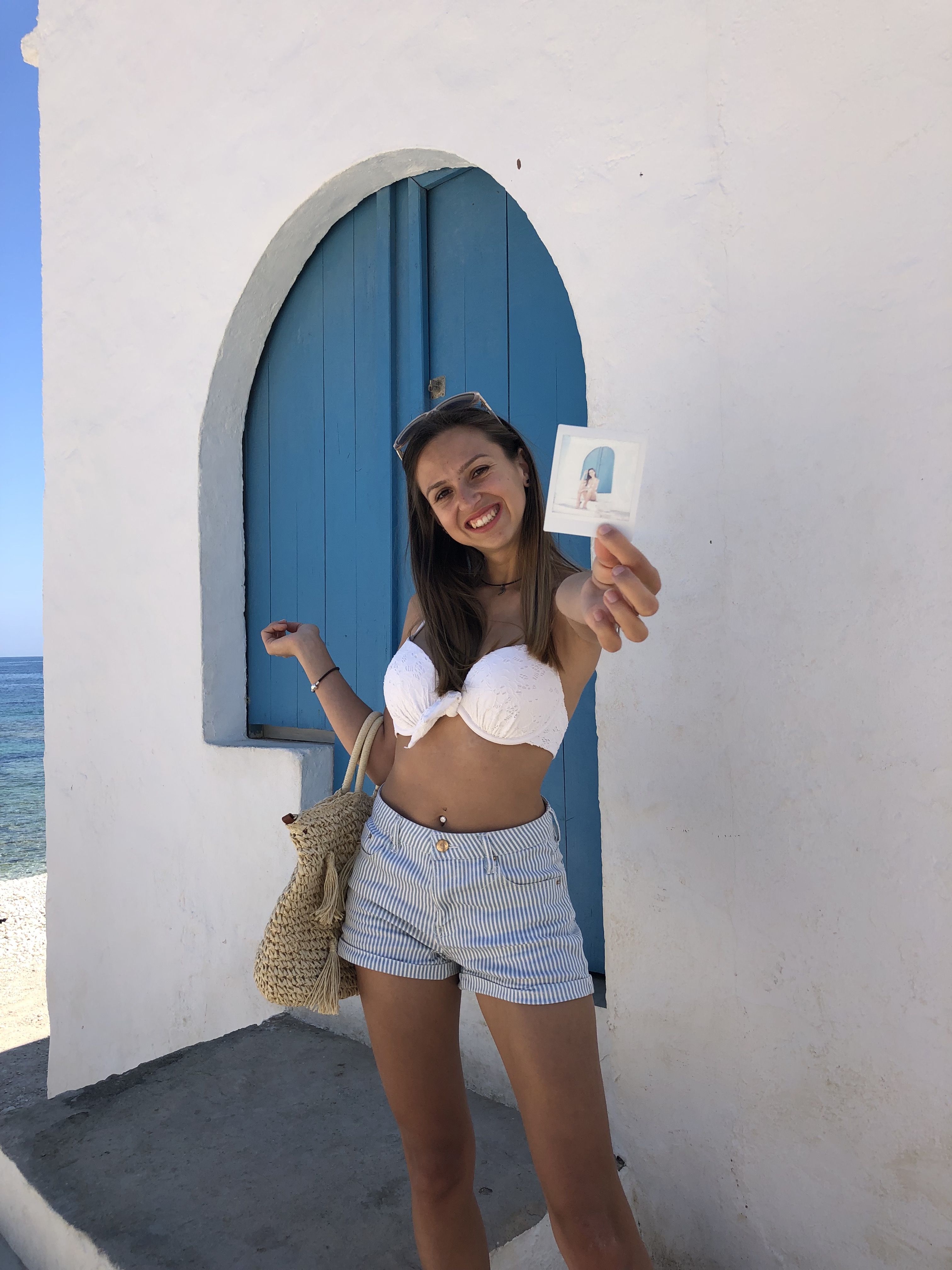 girl outside blue door javea fujifilm camera
