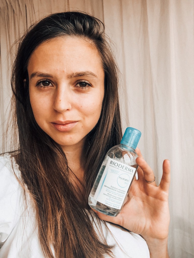 Selfie holding micellar water 