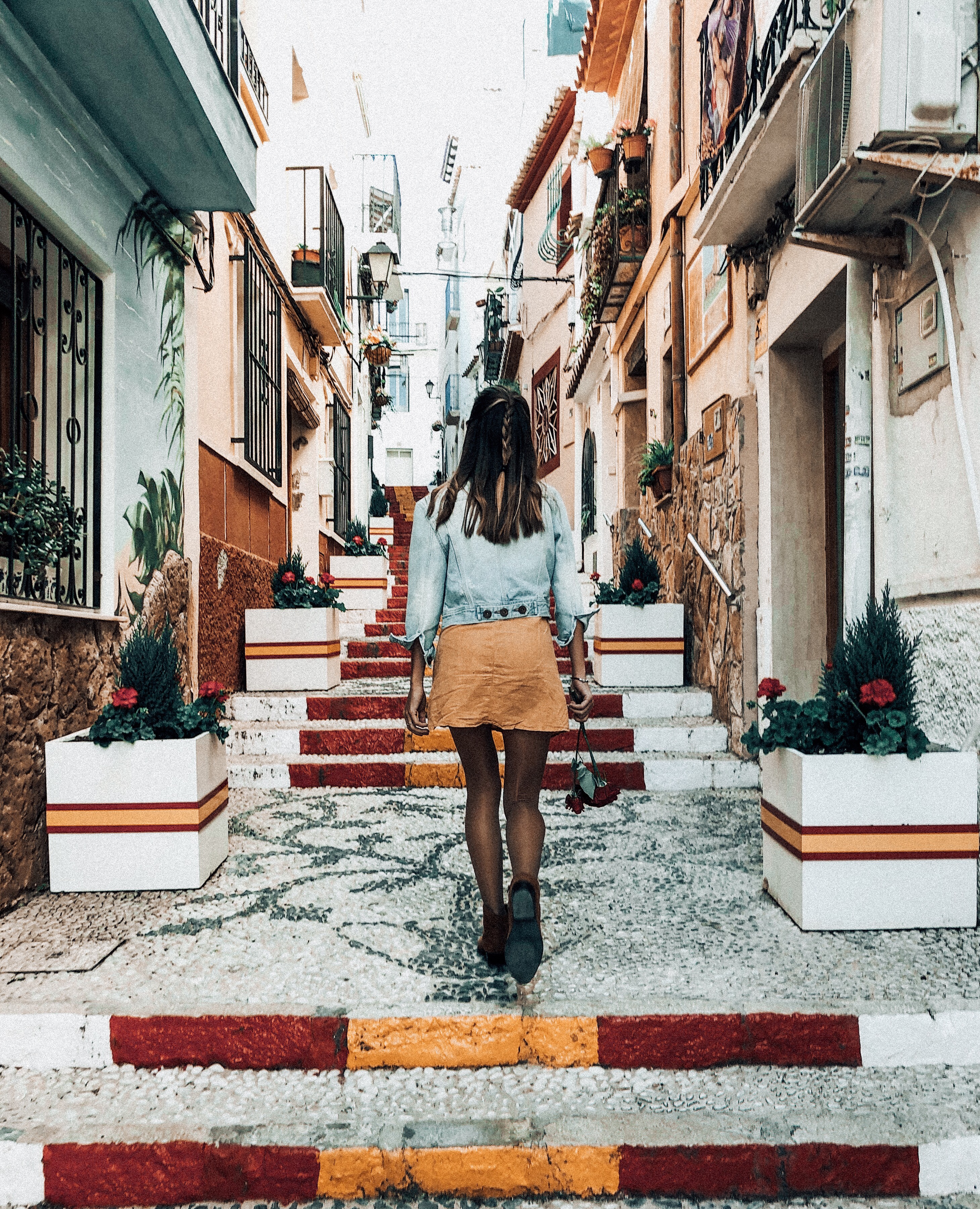 Walking the Spanish streets in calpe Spain with Spain flag painted famous location on costa blanca 