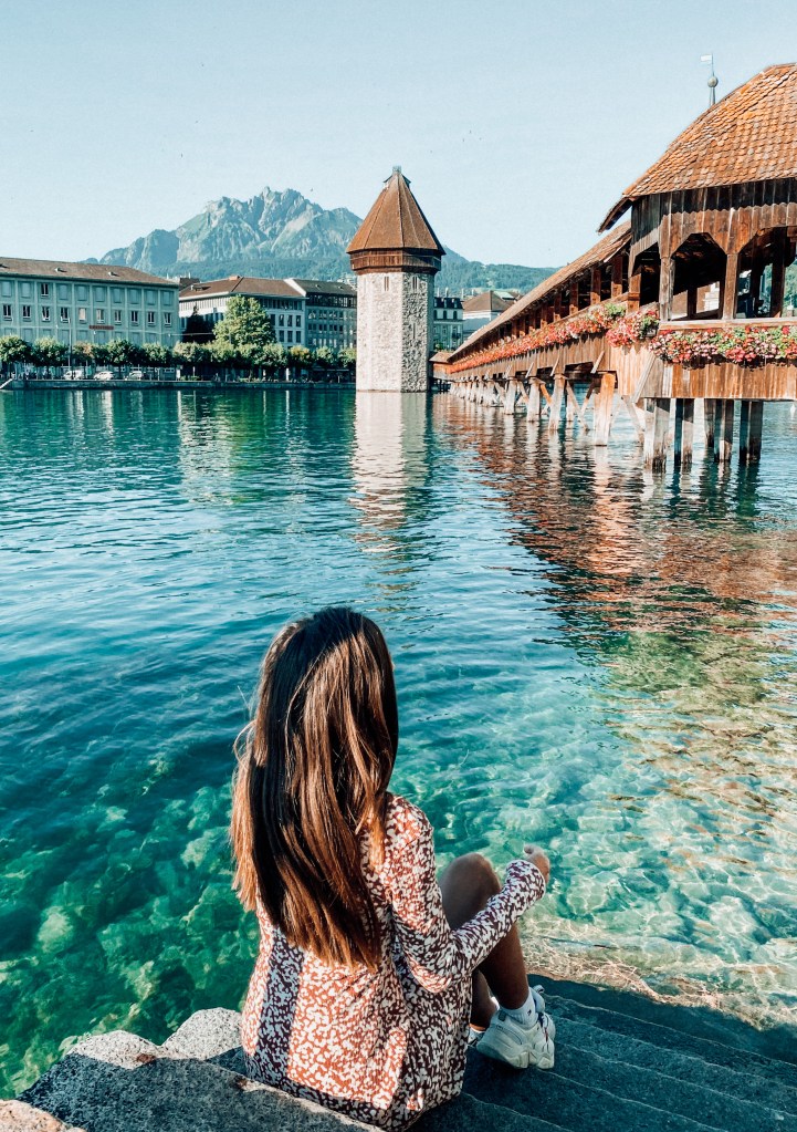 sitting looking at chapel bridge in lucerne switzerland