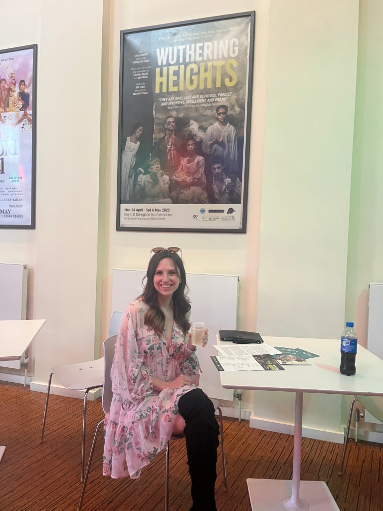 Lauren wearing kate bush inspired wuthering heights outfit pink with sunglasses prosecco and knee high boots at wuthering heights press night